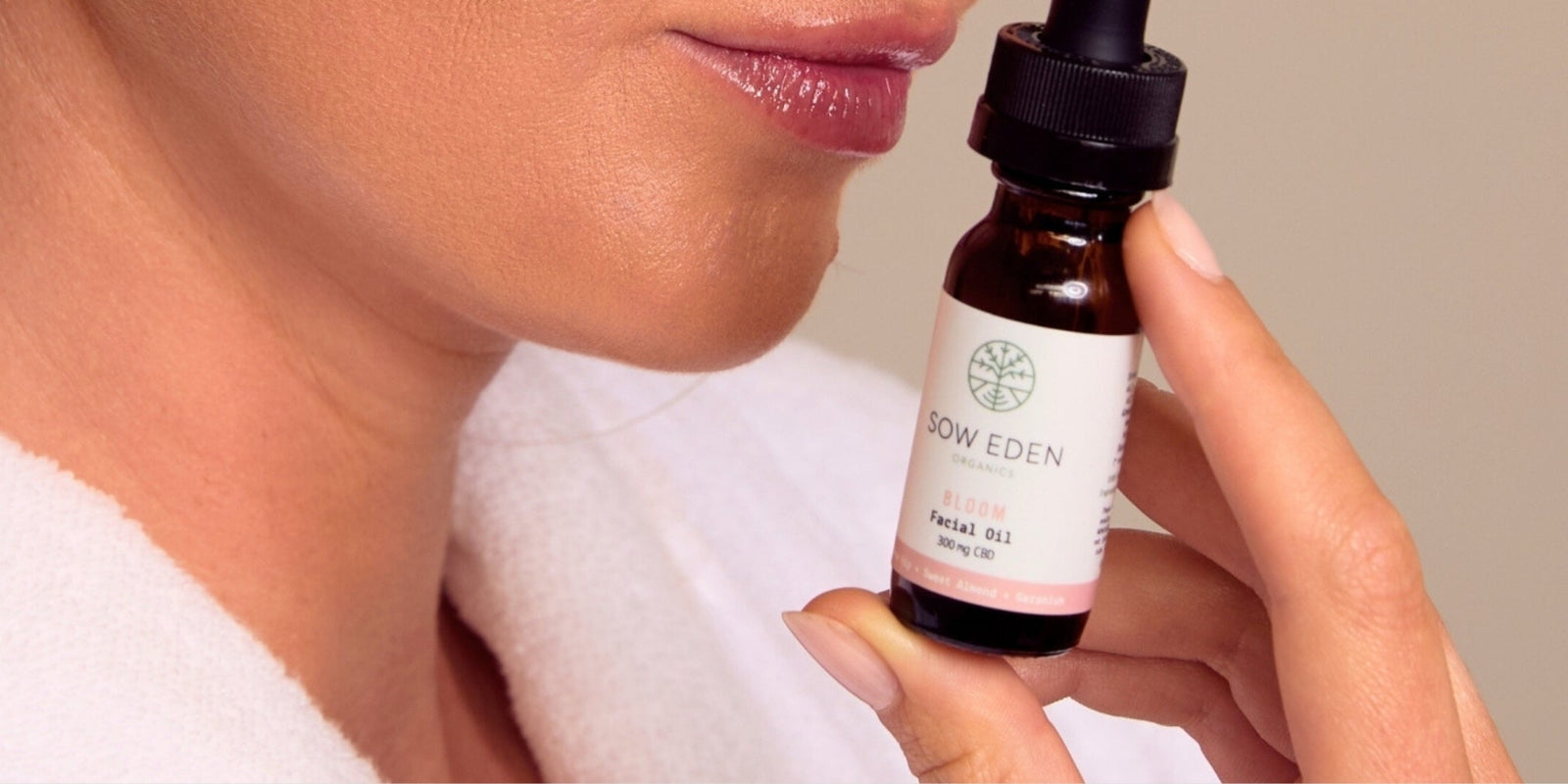 Woman relaxing in a calm intimate setting with botanical CBD wellness oil by Sow Eden supporting relaxation, intimacy, and sensory wellness